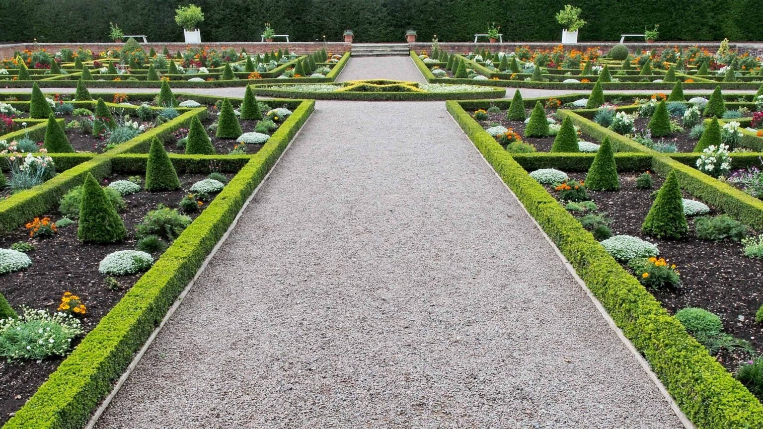Beautiful landscaped garden with manicured lawn and stone pathways